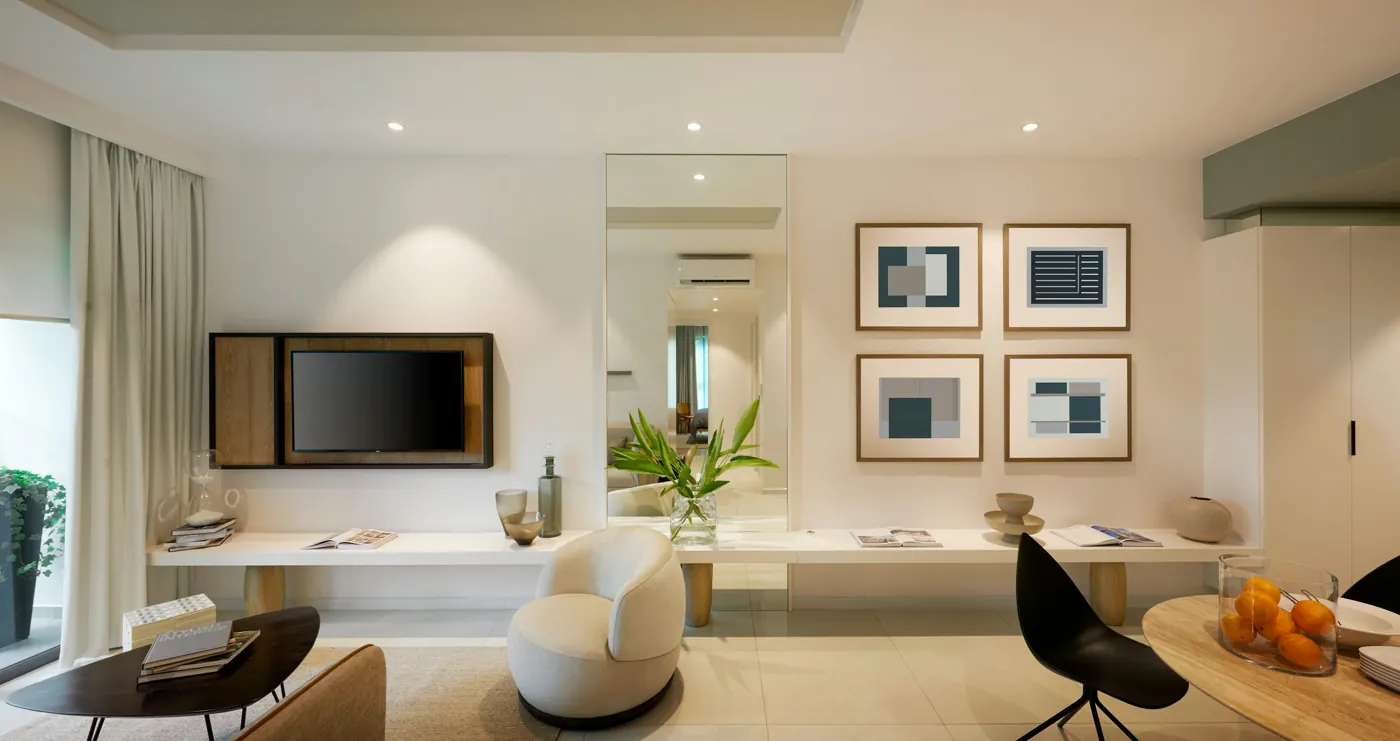 Un salón moderno con televisión, sillón y arte abstracto enmarcado